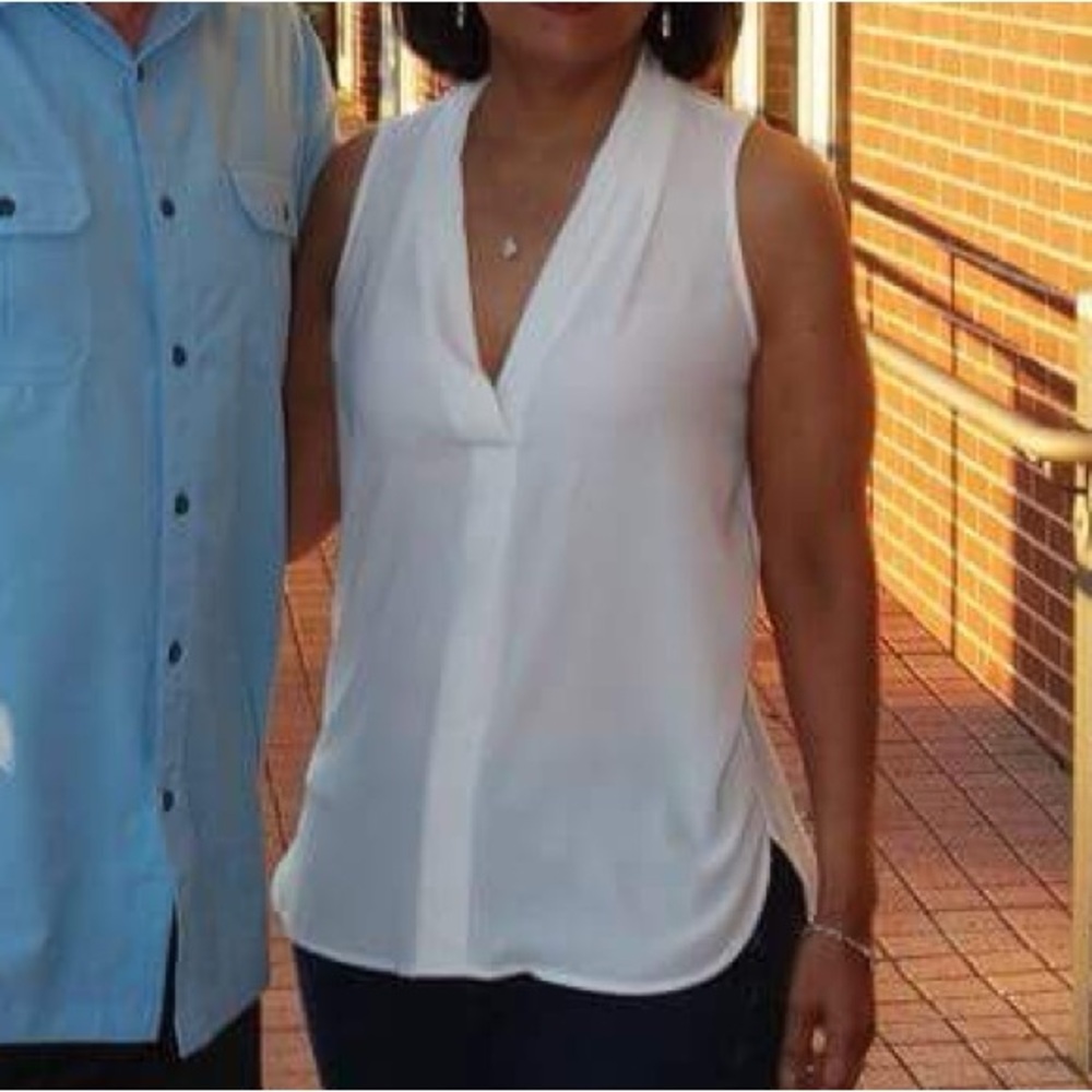 Vince Camuto sleeveless sheer white tank top blouse with plunge neck line.